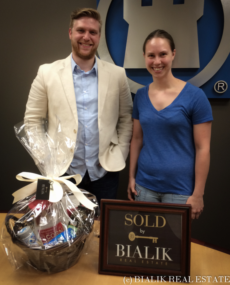 Justin Selby of Bialik Real Estate with Hearther Raab on closing day